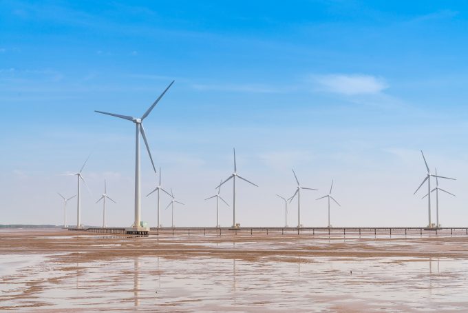 picture of a wind farm on what looks like mudflats