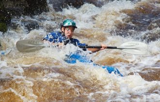 a kayaker in rapids
