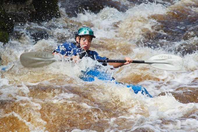 a kayaker in rapids