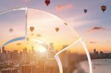 balloons flying over an Asian city at sunrise viewed through the JPMorgan circular symbol as though that was glass
