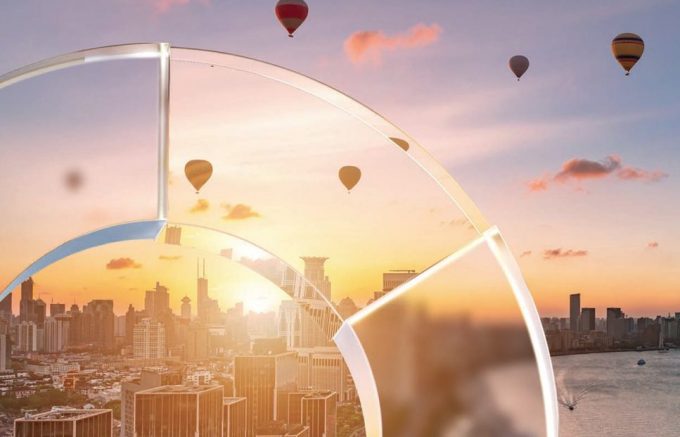 balloons flying over an Asian city at sunrise viewed through the JPMorgan circular symbol as though that was glass