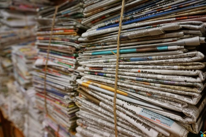bundles of newspapers tied up with string