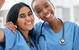 two smiling doctors/nurses
