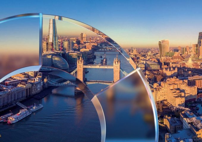 a view of London from east of Tower Bridge overlaid with the JPM transparent circle motif