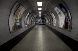 a view of a passenger tunnel in the London underground