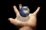 an image of Earth in the palm of a hand