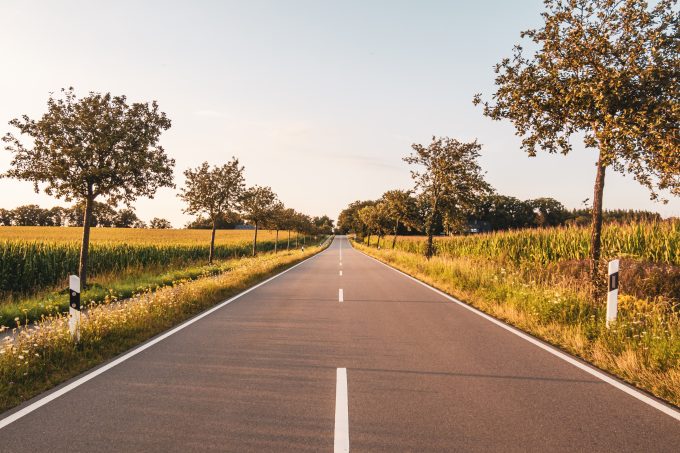 a straight open road in a flat landscape