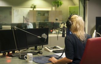 a presenter in a radio studio