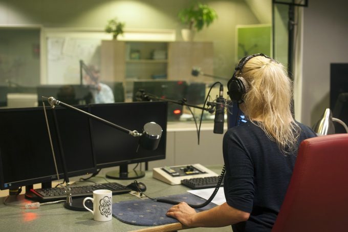 a presenter in a radio studio