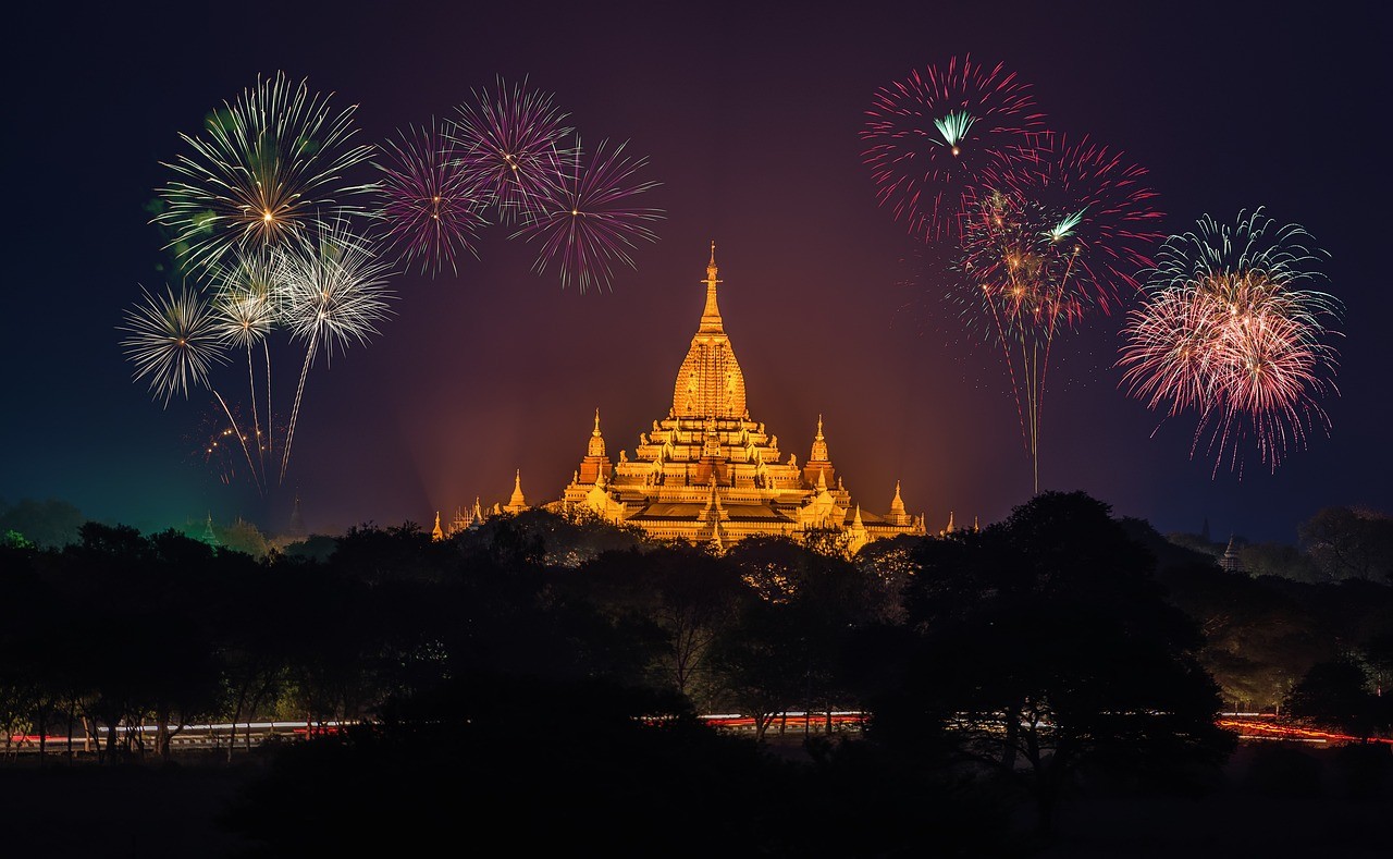 Asian architecture with fireworks in the background