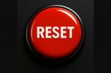 a big red reset button on a black background