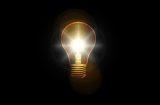 A bright light bulb symbolises a solution to a problem.