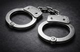 a picture of a pair of handcuffs on a grey background