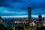 a view at dusk of taipei with the taipei 101 tower in the middle