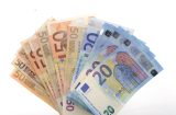 euro notes fanned out on a white background