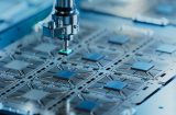 Close-up of a silicon die being extracted from a semiconductor wafer
