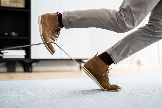 a person trips over a cable